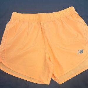 New Balance Women's Vibrant Orange Athletic Shorts
